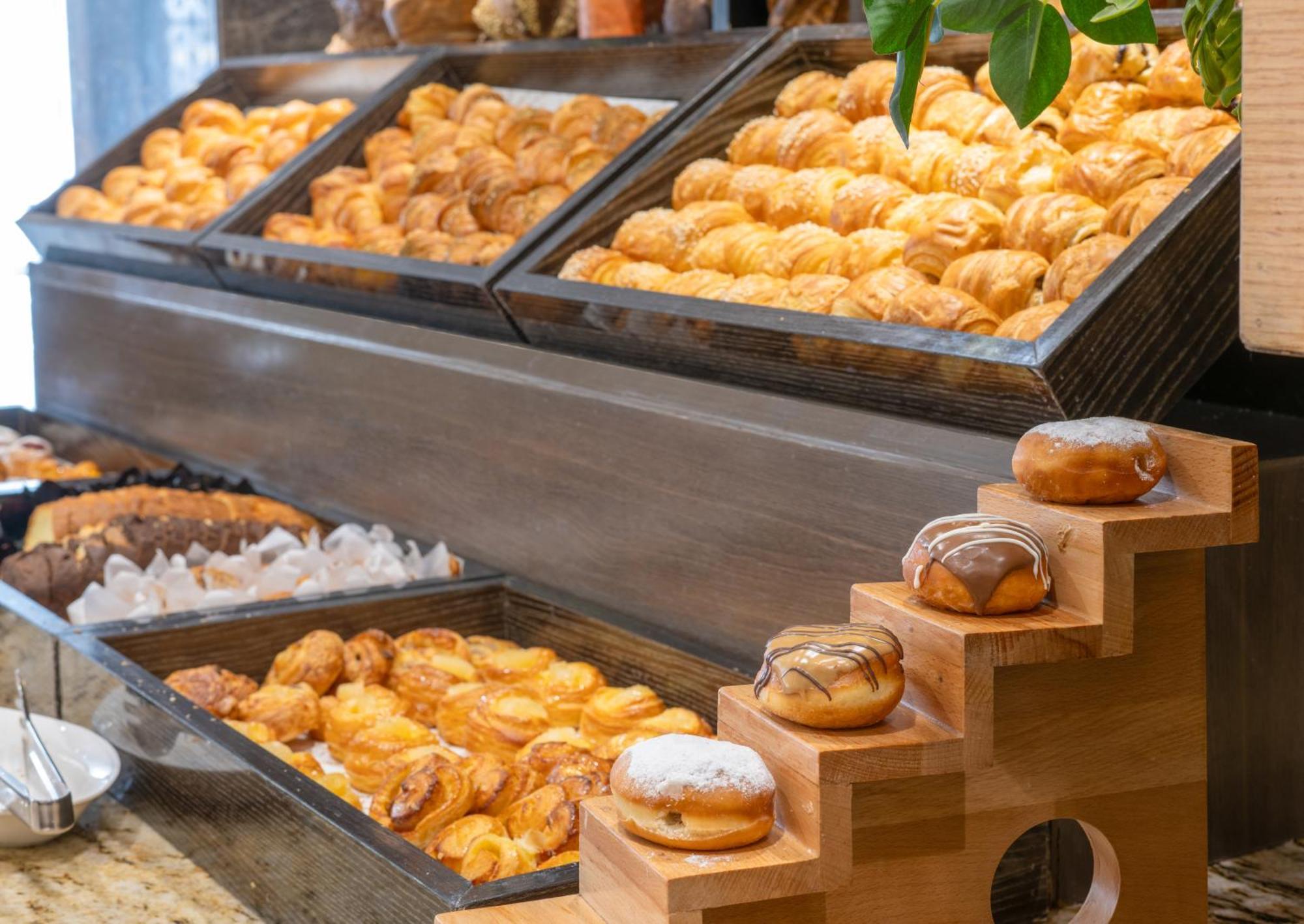 Triumph Luxury Hotel Kairo Bagian luar foto Croissants and other pastries at a buffet