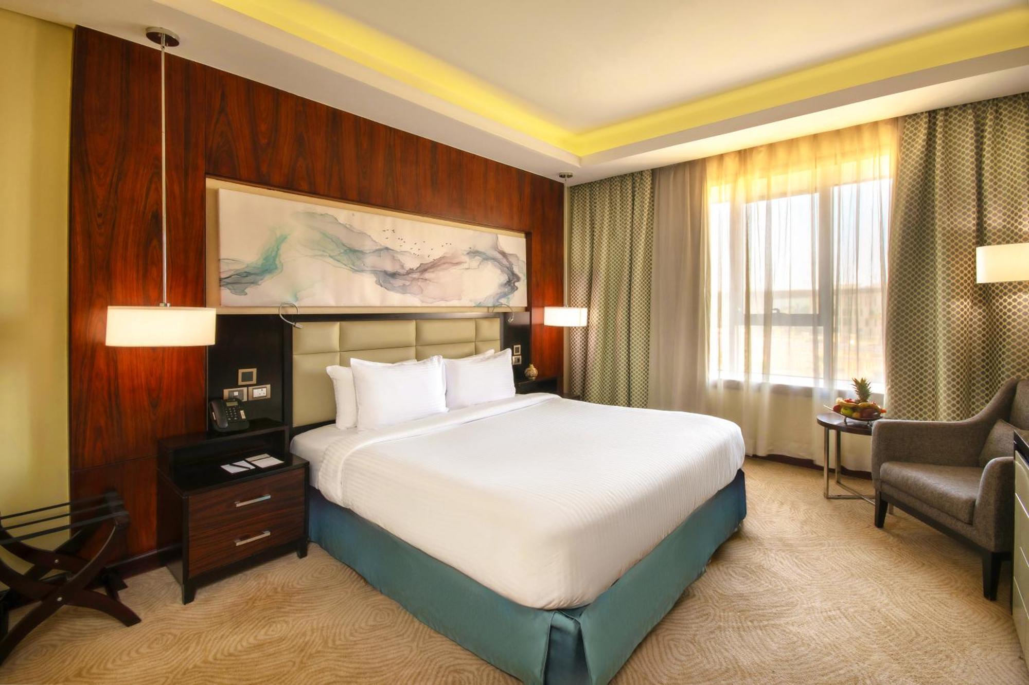 Triumph Luxury Hotel Kairo Ruang foto A bedroom at the hotel